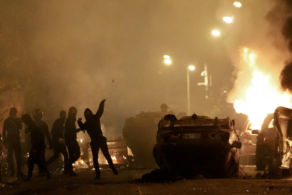 Youths clash with police in Nanterre.