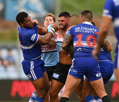 Bulldog Tevita Pangai jnr fires up at Cronulla’s Royce Hunt during pre-season trials.