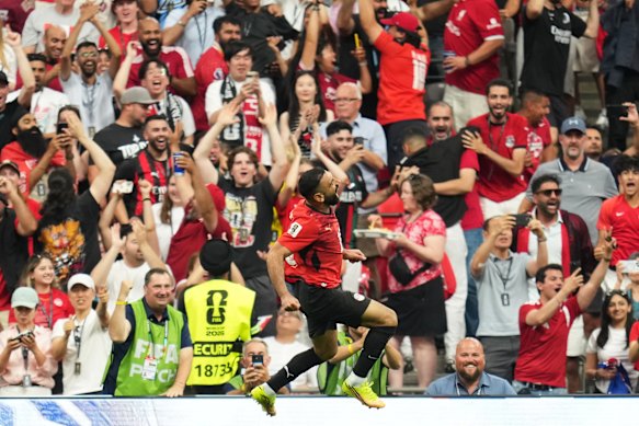 Salah celebrates with the crowd after giving Egypt the lead. 