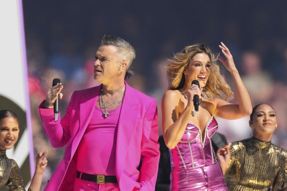 Robbie Williams with Delta Goodrem at last year’s grand final.