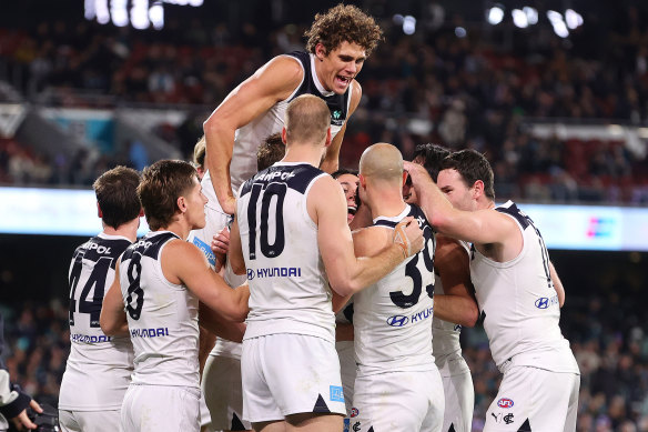 Carlton players mob Zac Williams after his last-term goal.