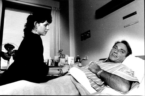 Ifield, who has been hospitalised with a collapsed lung, pictured with his girlfriend Venetis, at the Seventh Day Adventist hospital, Wahroonga in 1988.