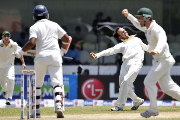 Nathan Lyon celebrates one of his five wickets on debut at Galle in 2011.
