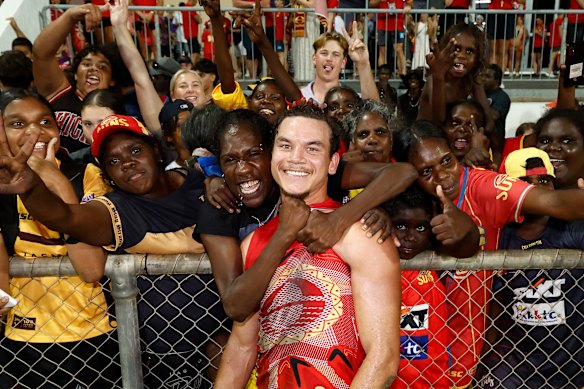 Daniel Rioli of the Suns celebrates laps up the love in Darwin.