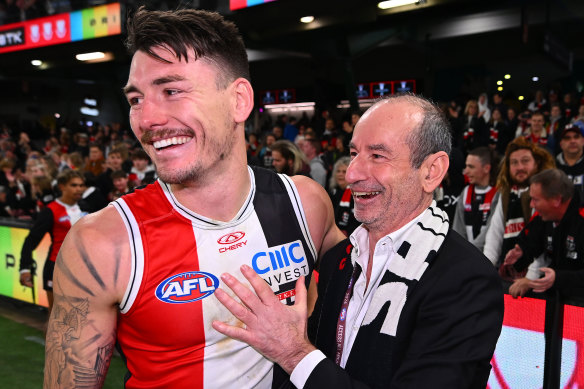 St Kilda president Andrew Bassat (right) embraces Josh Battle following the Saints’ win over the Swans.