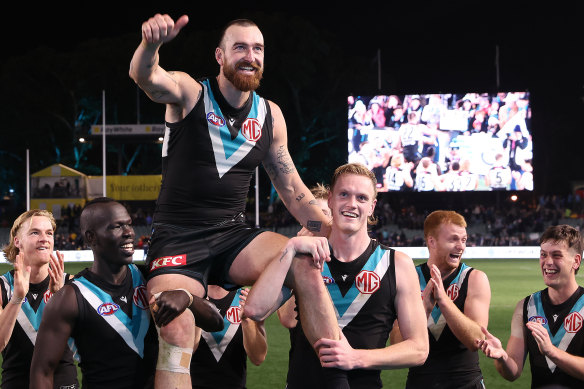 Thumbs up: Port salutes for Charlie Dixon in his 200the match.