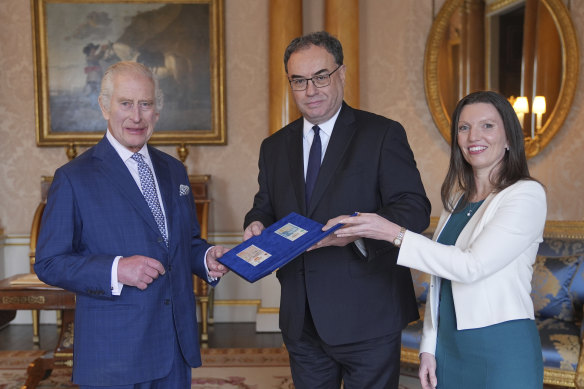 King Charles was presented with the first banknotes featuring his portrait by Bank of England governor Andrew Bailey and chief cashier Sarah John in April.