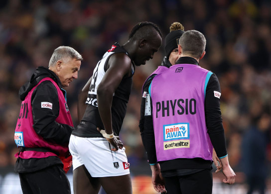 Port Adelaide’s Aliir Aliir leaves the ground after an on-field collision with teammate Lachie Jones last season.