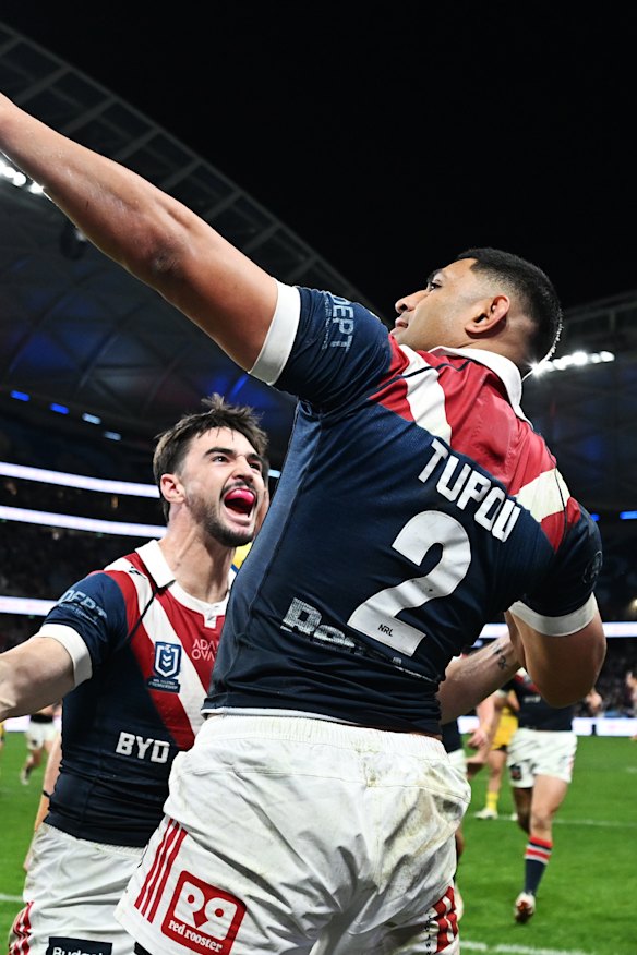 Daniel Tupou celebrates a try against Parramatta.