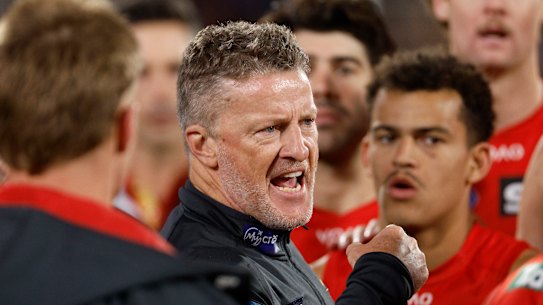Suns coach Damien Hardwick talks to his players.