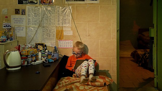 In the Kharkiv No 4 Emergency Hospital, three-year-old Viktor Baklanov sits in the basement, where he is sheltering with his father while his wounded brother Volodymyr is treated in one of the trauma wards. 