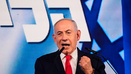 Israeli Prime Minister Benjamin Netanyahu speaks to supporters at Likud party headquarters in Jerusalem after polls closed in the election.