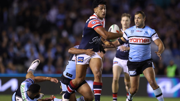 NRL finals as it happened: Roosters defeat Sharks 13-12 to book a spot in finals week two, Panthers dominate with 32-6 victory over the Warriors