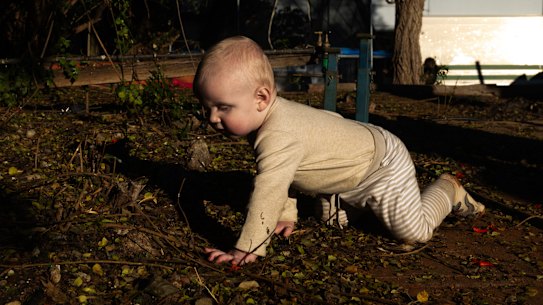 Marcus Phillips plays in dirt in Broken Hill.