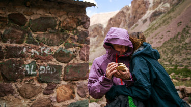 From left, Isabella de la Houssaye is hugged by her daughter, Bella, after their first day of trekking through Argentina's  Vacas Valley on their way to Acongagua.