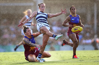 Chantel Emonson of the Cats gets a kick away against the Brisbane Lions.