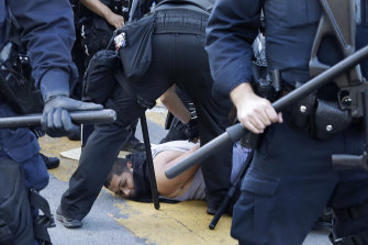 A protester is arrested by San Jose, California, police on Friday. Protests against the death in custody of black man George Floyd have spread throughout the US.