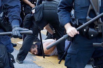 A protester is arrested by San Jose, California, police on Friday. Protests against the death in custody of black man George Floyd have spread throughout the US.