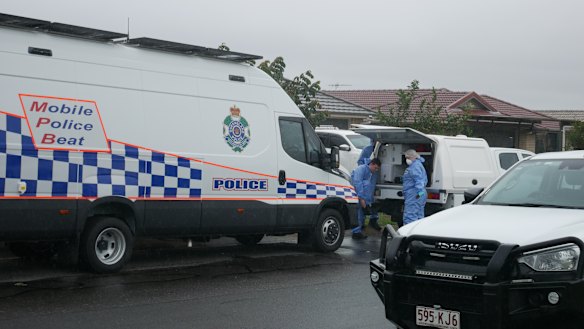 Forensic police could be seen donning gloves and shoe covers before entering the property. 