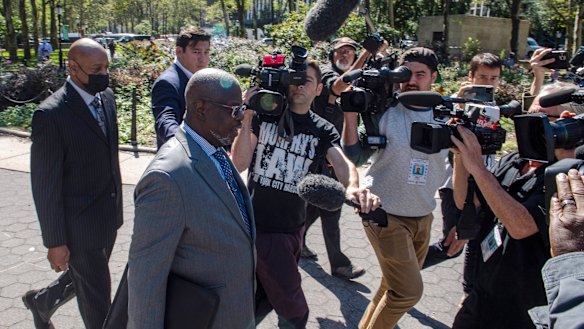 Deveraux Cannick, lawyer for R. Kelly, is surrounded by the media during a break at the Brooklyn Federal Court House in New York.