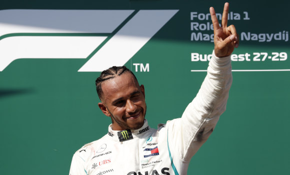 Mercedes driver Lewis Hamilton on the podium after winning the Hungarian Formula One Grand Prix at the Hungaroring racetrack in Mogyorod, near Budapest, on Sunday.