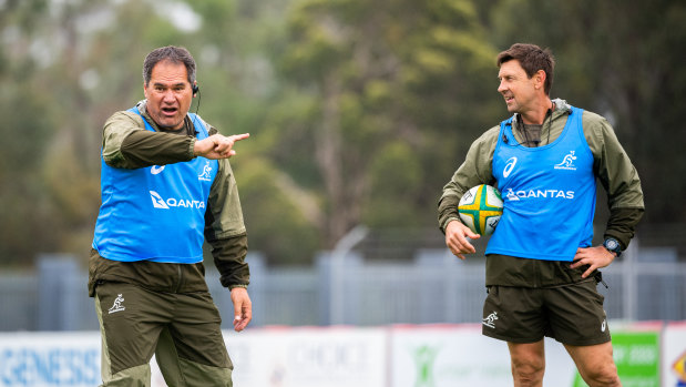 Wallabies coach Dave Rennie and assistant Scott Wisemantel watch on at training in the Hunter Valley on Tuesday. 
