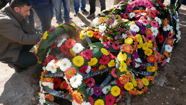 Aiia Maasarwe's coffin covered in flowers.
