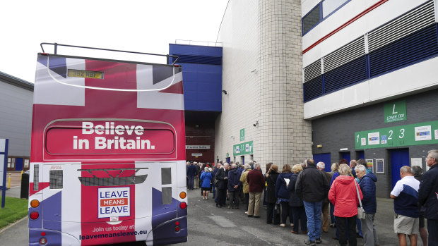 Brexiters queued beside a new Brexit 'battle bus' in Bolton.