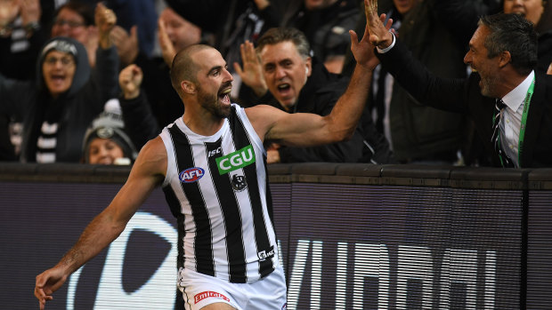 Steele Sidebottom scores a high five after one of his goals.