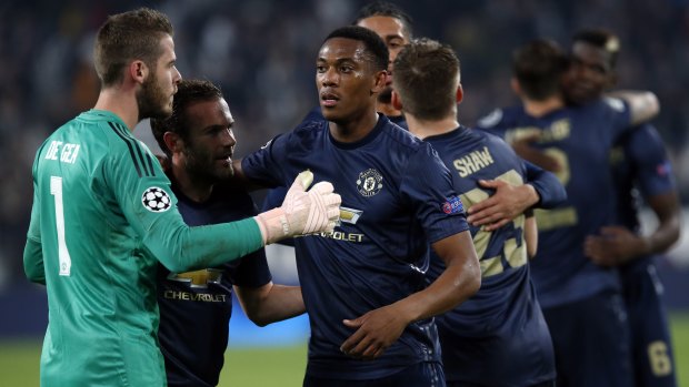 United celebrate their win over Juventus.