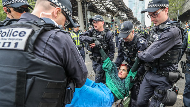 Police remove a protester on Thursday.