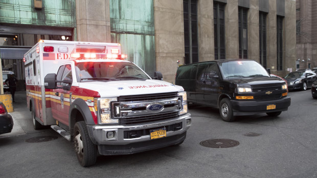 An ambulance carrying Harvey Weinstein is escorted from a Manhattan courthouse.