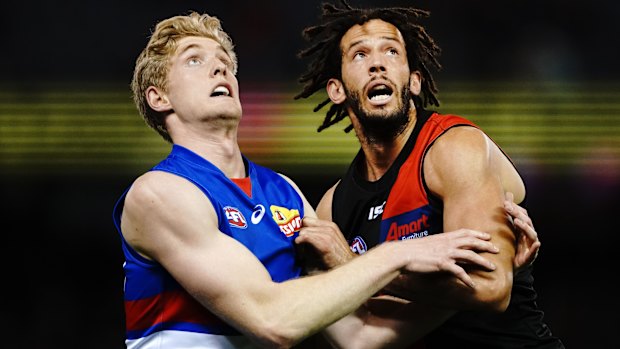 Ruck solid: Bulldog Tim English goes up against Essendon's Zac Clarke.