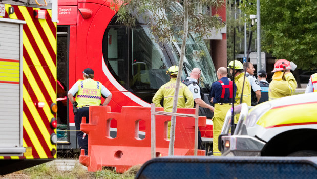 Emergency services at the scene of a collision involving a tram and a pedestrian at the intersection of Northbourne Avenue and Barry Drive on March 9.