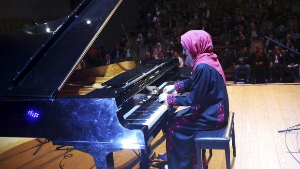 Palestinian pianist Yara Thabit plays the restored piano.