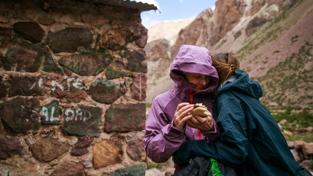 From left, Isabella de la Houssaye is hugged by her daughter, Bella, after their first day of trekking through Argentina's  Vacas Valley on their way to Acongagua.