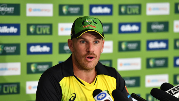 Aaron Finch fronts the media.