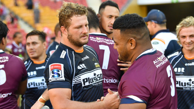 James Slipper shaking hands with former Reds teammate Taniela Tupou.