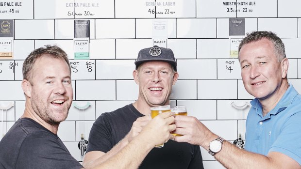 Balter CEO and co-founder Ant Macdonald, co-founder Mick Fanning and CUB chief executive Peter Filipovic. 