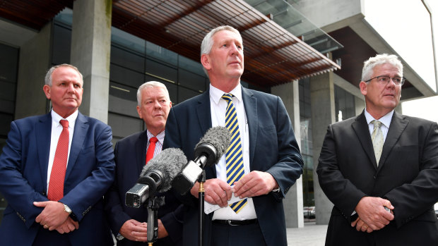 Joe, John, Dennis and Neill Wagner speak to the media outside the Supreme Court after the verdict in their defamation proceedings against Alan Jones. 