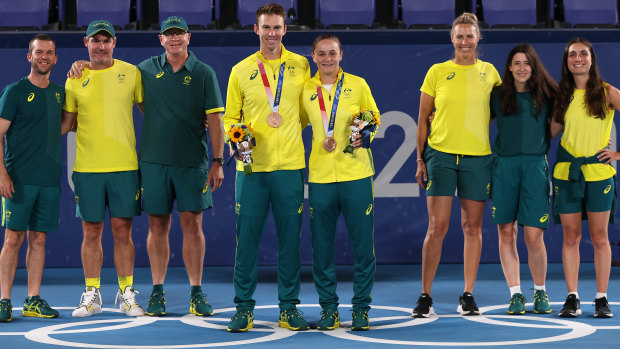 Bronze medallists Peers and Barty with members of the Australian team in Tokyo.