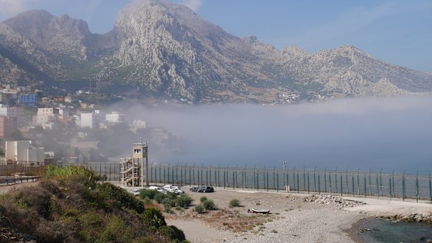 Looking west from Ceuta across the border fence to the Moroccan mountain Jebel Musa.