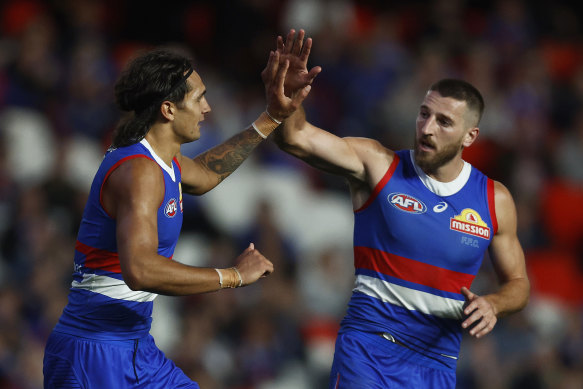 Jamarra Ugle-Hagan of the Bulldogs (L) celebrates with Marcus Bontempelli of the Bulldogs.