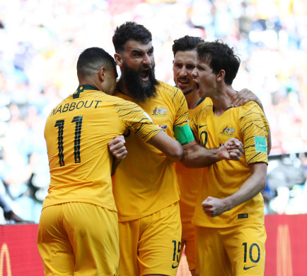 The Socceroos celebrate then-captain Mile Jedinak’s penalty against France in 2018.