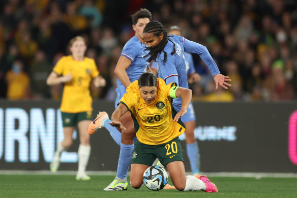 Sam Kerr of the Matildas competes for the ball against Wendie Renard of France.