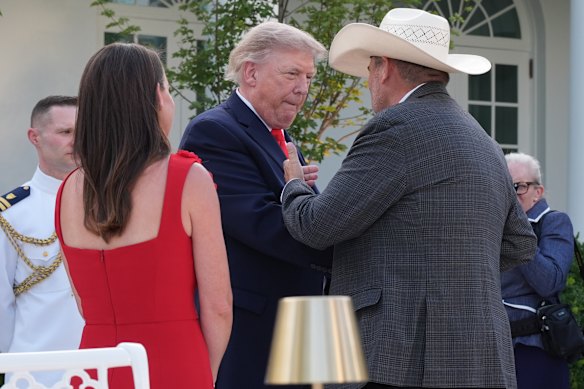 Trump meeting with farmers in the White House Rose Garden in June.