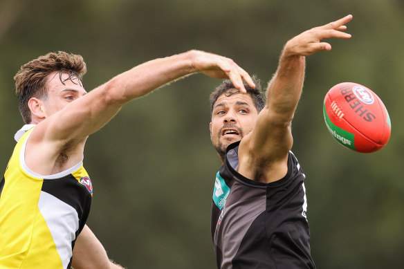 Paul Hunter and Paddy Ryder compete during a St Kilda training session.
