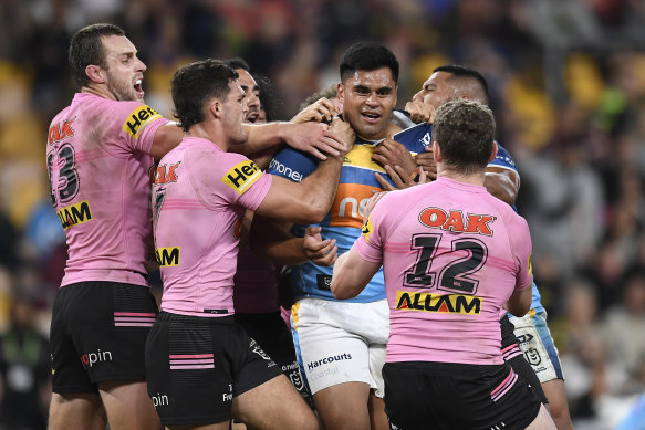 Herman Ese’ese is confronted by the Panthers before his sending-off at Suncorp Stadium.