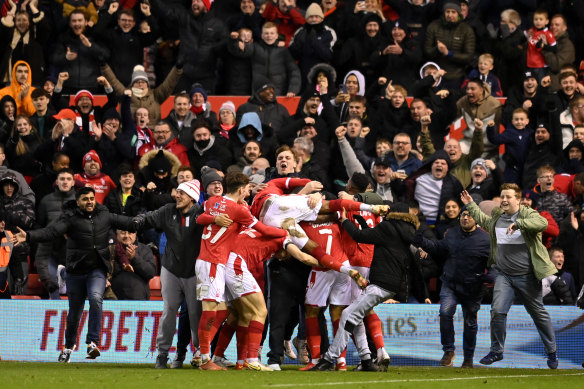 Nottingham Forest celebrate their goal as the fans erupt in the stands.