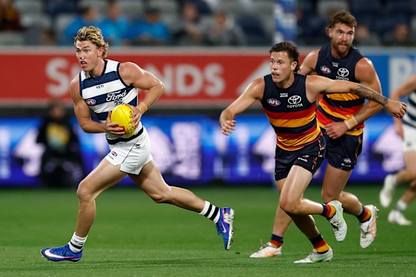 Tanner Bruhn bursts clear with ball in hand against the Crows. 